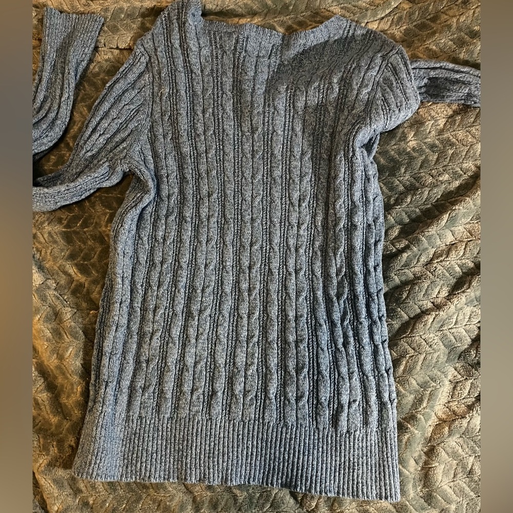 Blue sweater.
